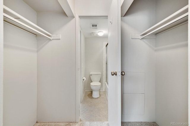 15202 E Hampden Cir Unit F2, Aurora, CO 80014 - full bathroom featuring enclosed tub / shower combo and tile patterned flooring