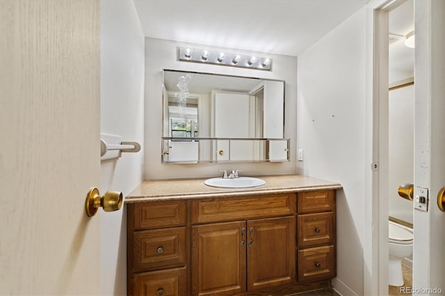 15202 E Hampden Cir Unit F2, Aurora, CO 80014 - bathroom featuring vanity and toilet
