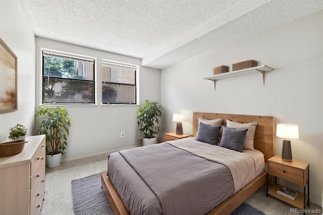 15202 E Hampden Cir Unit F2, Aurora, CO 80014 - carpeted bedroom featuring a textured ceiling and baseboards
