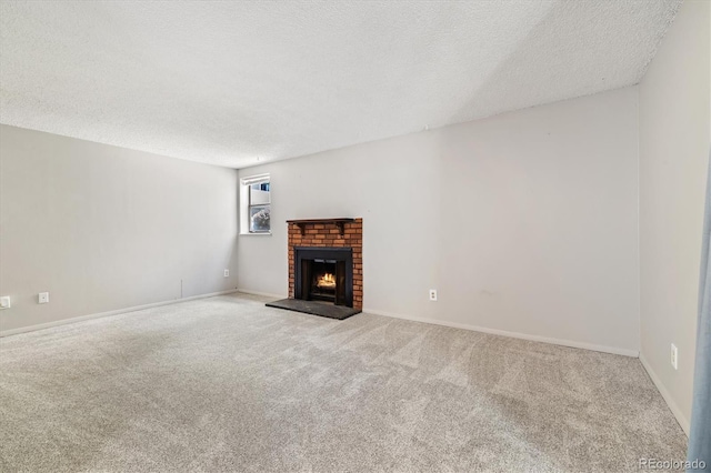 15202 E Hampden Cir Unit F2, Aurora, CO 80014 - unfurnished living room with a textured ceiling, carpet, and a brick fireplace