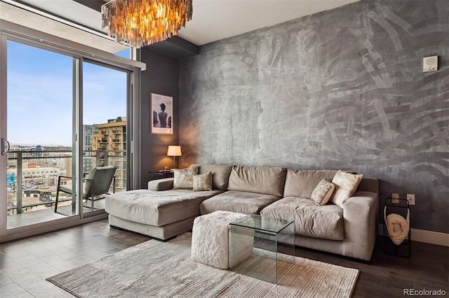 living room featuring wood finished floors and an inviting chandelier