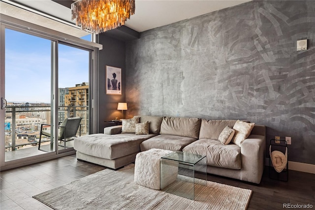 2001 Lincoln St Unit 920, Denver, CO 80202 - living room featuring baseboards, a wealth of natural light, wood finished floors, and a notable chandelier
