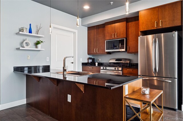 2001 Lincoln St Unit 920, Denver, CO 80202 - kitchen with a kitchen breakfast bar, dark countertops, a sink, a peninsula, and stainless steel appliances
