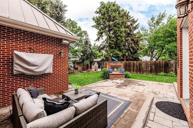 1332 S Lafayette St, Denver, CO 80210 - view of patio with an outdoor living space with a fireplace