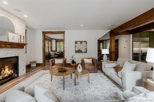 1332 S Lafayette St, Denver, CO 80210 - living area featuring light wood-style flooring, a fireplace, and recessed lighting