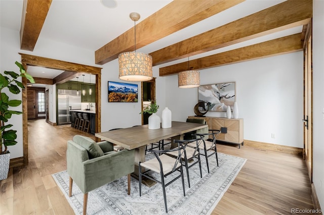 1332 S Lafayette St, Denver, CO 80210 - dining room with beamed ceiling and light wood-type flooring