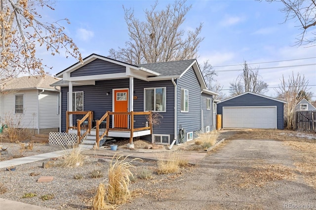 view of front of house featuring a garage and an outdoor structure