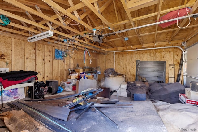 garage featuring wood walls