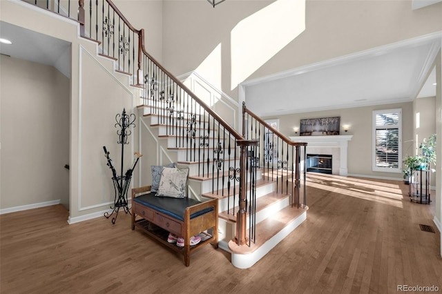 staircase with wood-type flooring