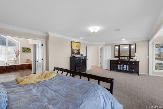 bedroom with french doors, ornamental molding, and carpet flooring