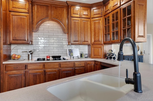 kitchen featuring black gas stovetop and decorative backsplash