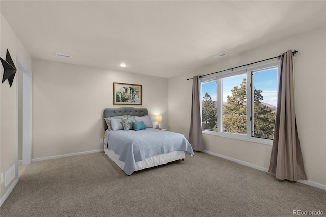 bedroom with light colored carpet