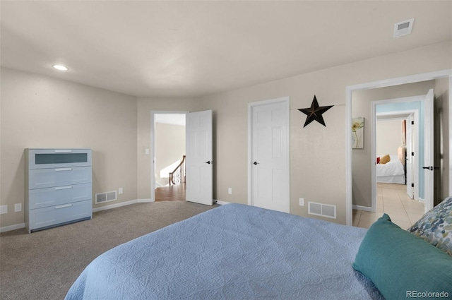 bedroom featuring light carpet