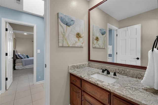 bathroom featuring vanity and tile patterned flooring