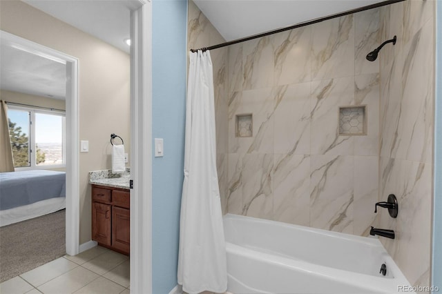 bathroom featuring shower / tub combo, vanity, and tile patterned flooring