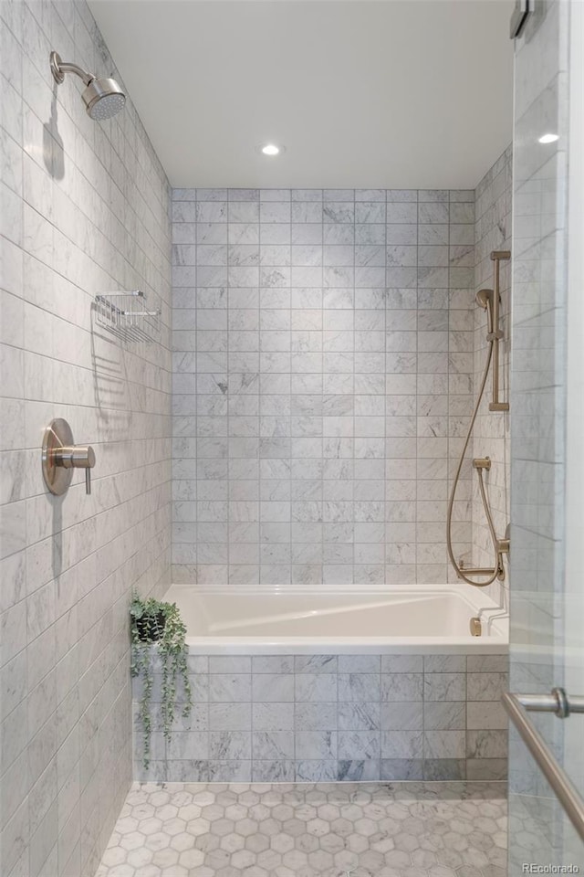 1750 Wewatta St Unit 809, Denver, CO 80202 - full bathroom featuring tiled shower / bath, tile patterned floors, tile walls, and recessed lighting