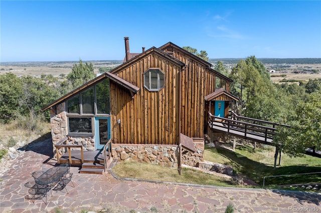 back of house featuring a patio area