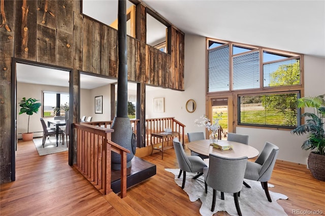 dining space with hardwood / wood-style flooring