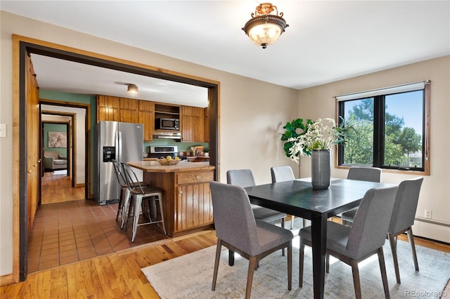 dining space featuring dark wood-type flooring