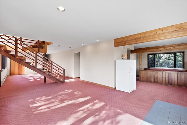 basement featuring light colored carpet and white refrigerator