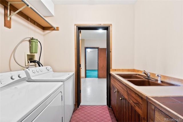 laundry room featuring sink and washing machine and clothes dryer