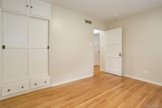 unfurnished bedroom featuring light hardwood / wood-style floors