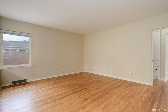 spare room with light wood-type flooring