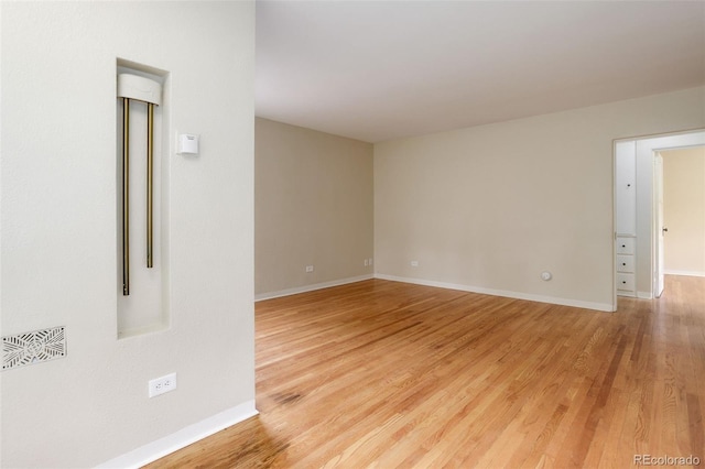 spare room featuring light hardwood / wood-style flooring