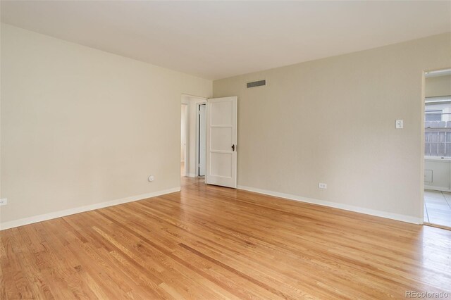 spare room featuring light hardwood / wood-style flooring