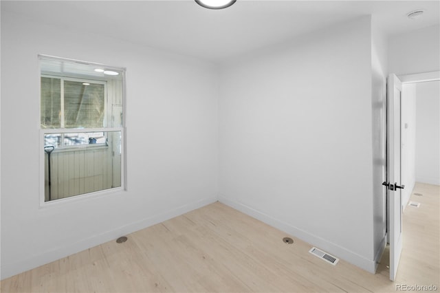 spare room featuring light hardwood / wood-style flooring