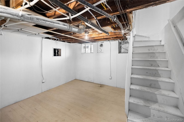 basement with hardwood / wood-style floors