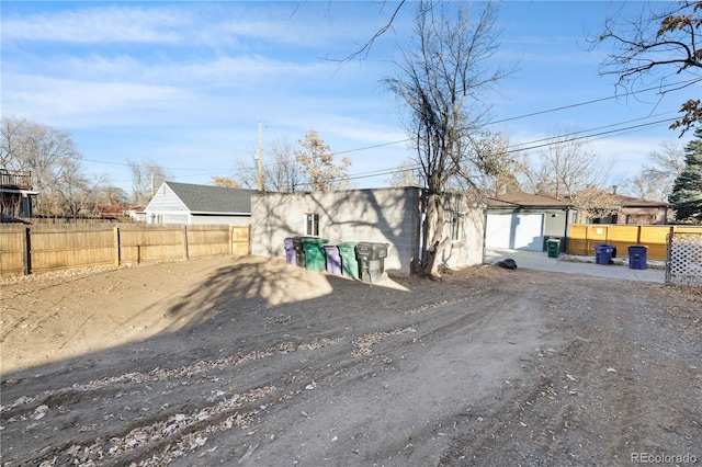 view of front facade with a garage and an outdoor structure