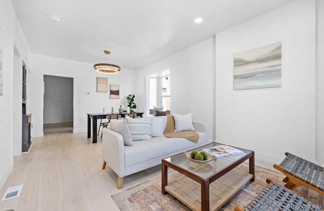 2207 E 25th, Denver, CO 80205 - living room with light wood-style floors, baseboards, and recessed lighting