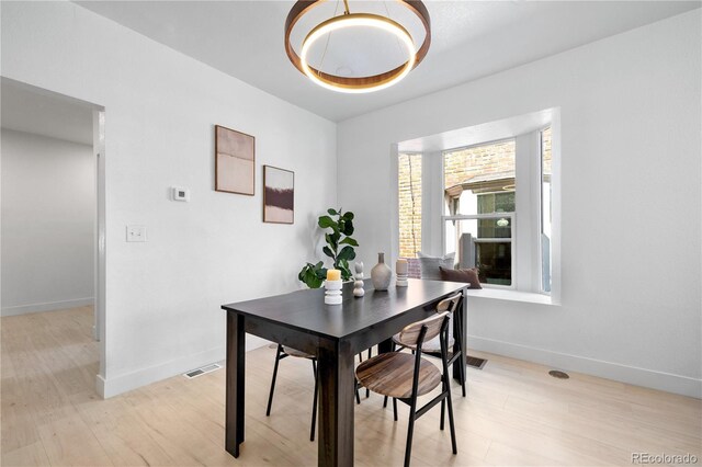 2207 E 25th, Denver, CO 80205 - dining area featuring light wood finished floors and baseboards