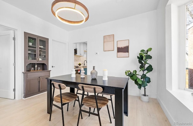 2207 E 25th, Denver, CO 80205 - dining space with light wood-style floors and baseboards