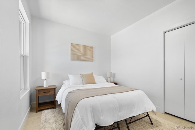 2207 E 25th, Denver, CO 80205 - bedroom featuring light wood-style floors and baseboards