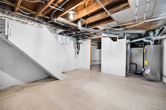 2207 E 25th, Denver, CO 80205 - unfinished below grade area featuring gas water heater and wood finished floors