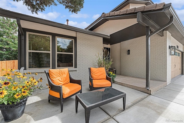 view of patio / terrace featuring a garage