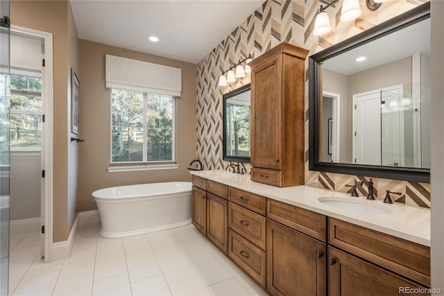 bathroom with vanity and a tub