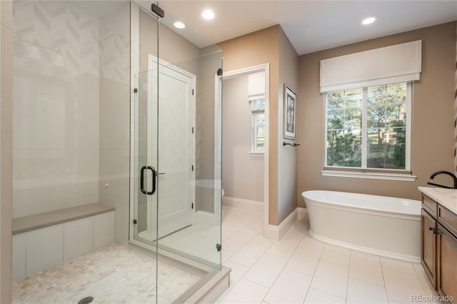 bathroom with vanity, independent shower and bath, and tile patterned flooring