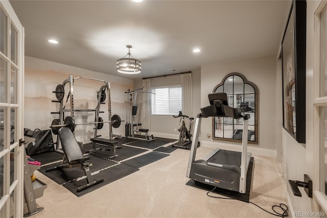 exercise area featuring carpet