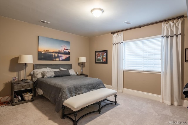 bedroom featuring light carpet