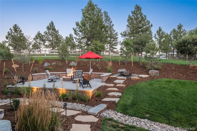 view of patio with a fire pit