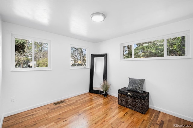 1148 N Clinton St, Aurora, CO 80010 - spare room featuring baseboards and light wood-style floors