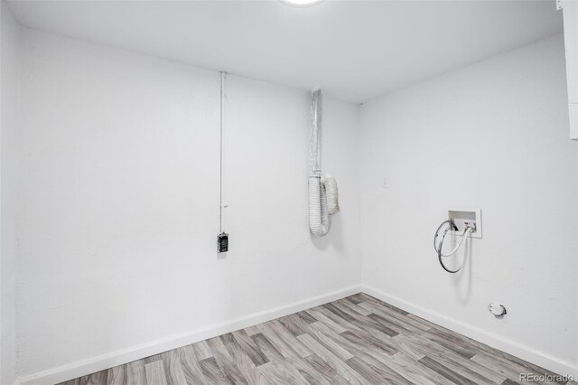 1148 N Clinton St, Aurora, CO 80010 - clothes washing area featuring washer hookup, light wood-style flooring, and baseboards
