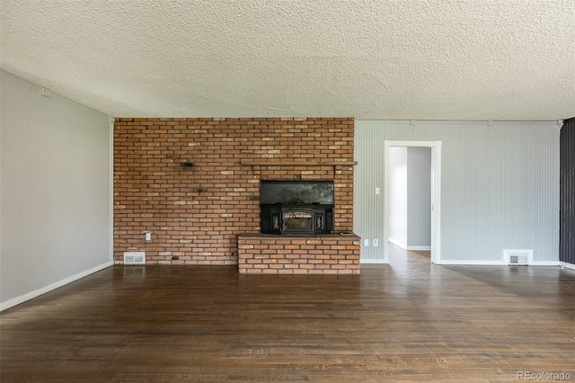 1345 Laredo St, Aurora, CO 80011 - unfurnished living room with wood finished floors, visible vents, and baseboards