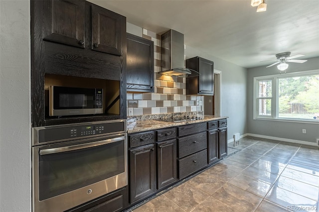 1345 Laredo St, Aurora, CO 80011 - kitchen featuring baseboards, ceiling fan, wall chimney exhaust hood, tasteful backsplash, and appliances with stainless steel finishes