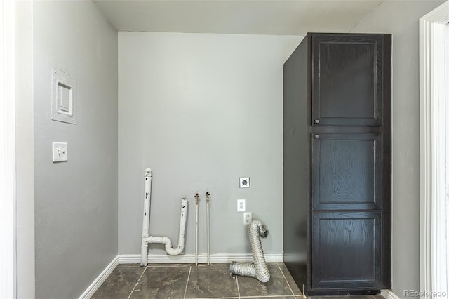 1345 Laredo St, Aurora, CO 80011 - laundry room with baseboards, cabinet space, and electric dryer hookup