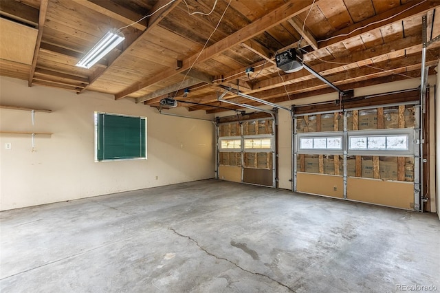 1345 Laredo St, Aurora, CO 80011 - garage featuring wood ceiling and a garage door opener