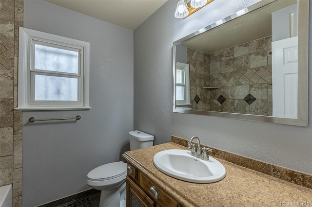 1345 Laredo St, Aurora, CO 80011 - bathroom with vanity, toilet, and a shower